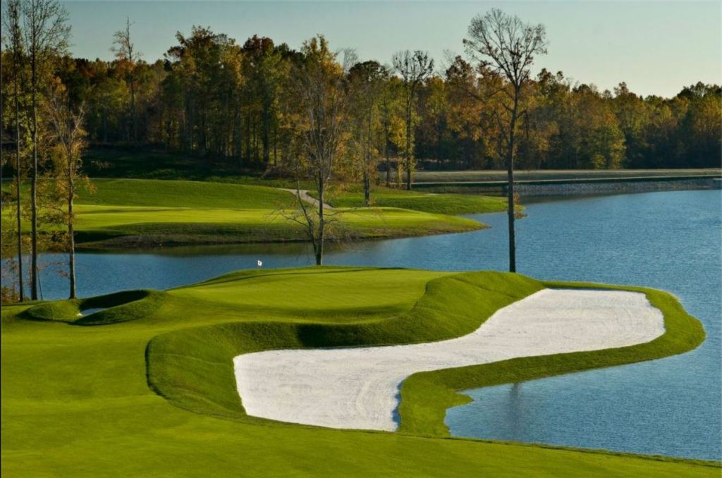 Golf course with lake and trees