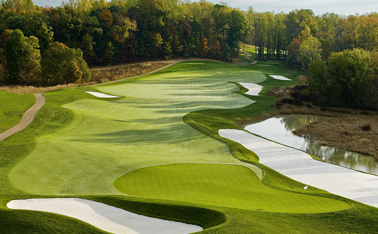 view of golf course with bunkers